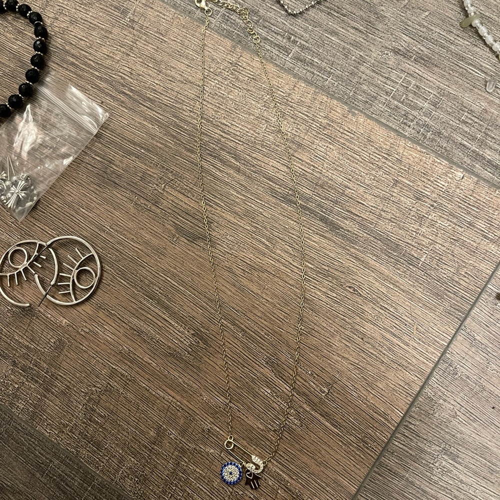 gold evil eye hamsa necklace